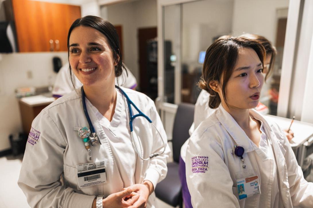 Ashland University nursing students in lab coats